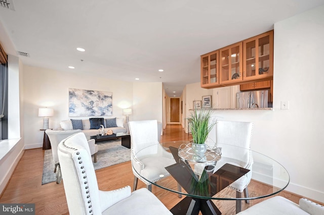 dining space featuring light hardwood / wood-style flooring