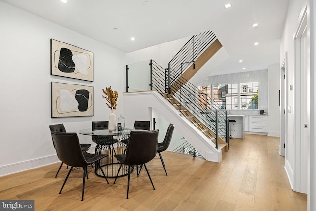 dining space featuring light wood-type flooring