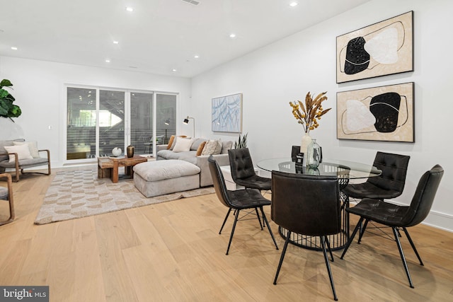 dining space featuring light hardwood / wood-style flooring