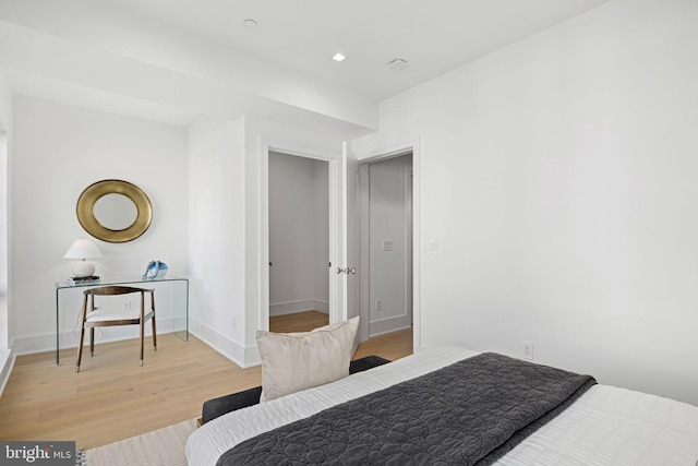 bedroom with wood-type flooring