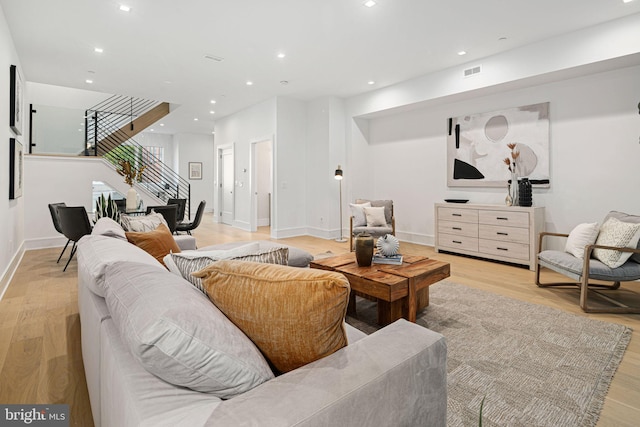 living room with light hardwood / wood-style floors