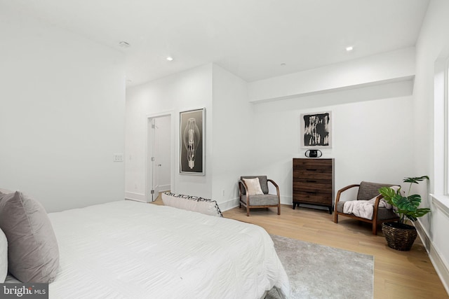 bedroom with light hardwood / wood-style flooring