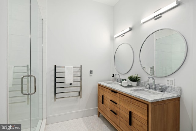 bathroom with vanity, radiator heating unit, and walk in shower