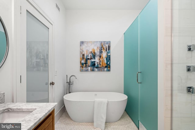 bathroom featuring tile patterned flooring, vanity, and independent shower and bath