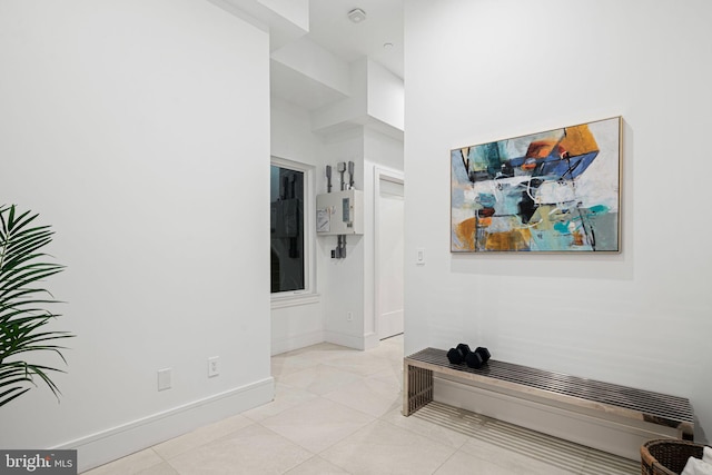 hall with light tile patterned flooring