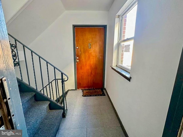 foyer entrance with a wealth of natural light