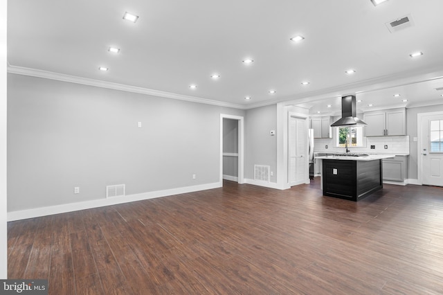 living room with dark hardwood / wood-style floors and ornamental molding