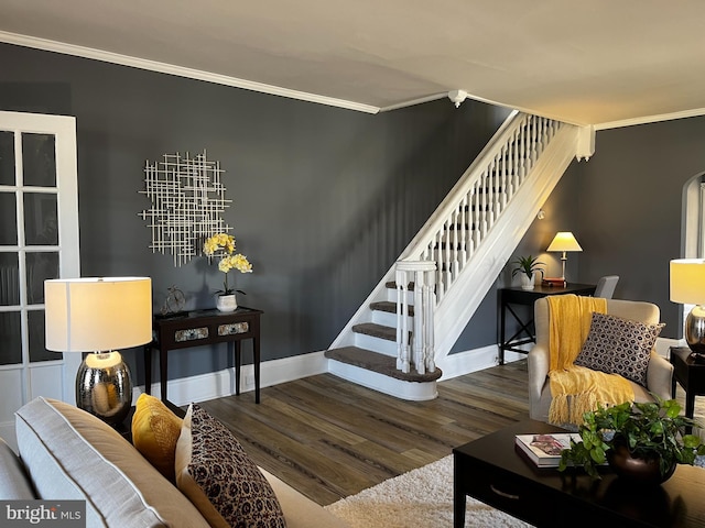 living room with hardwood / wood-style floors and ornamental molding