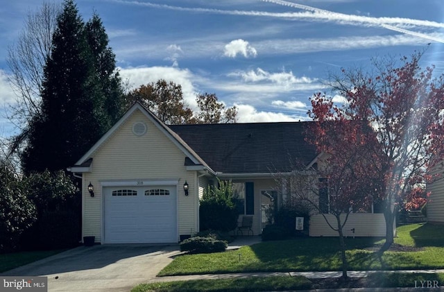 ranch-style home with a front yard and a garage