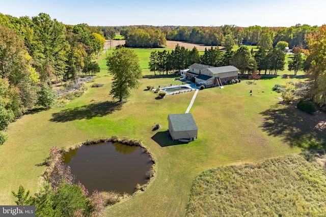 drone / aerial view featuring a rural view and a water view