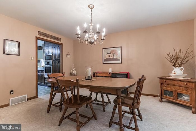 220 Robinson Rd, Salem, NJ 08079 - dining room featuring a chandelier, light colored carpet, and baseboards