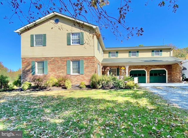 front of property with a front lawn and a garage