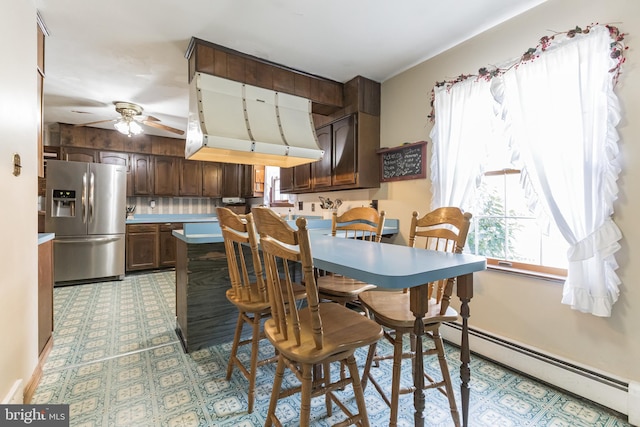 220 Robinson Rd, Salem, NJ 08079 - dining area featuring a baseboard radiator, a ceiling fan, and light flooring