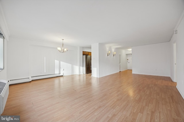 unfurnished living room with a notable chandelier, light wood-type flooring, ornamental molding, and a baseboard heating unit