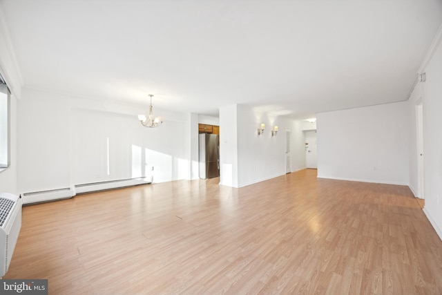 1900 John F Kennedy Unit 2002, Philadelphia, PA 19103 - unfurnished living room with a chandelier, light wood-type flooring, and a baseboard heating unit