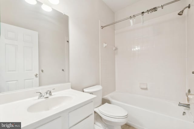 full bathroom featuring vanity, toilet, and tiled shower / bath