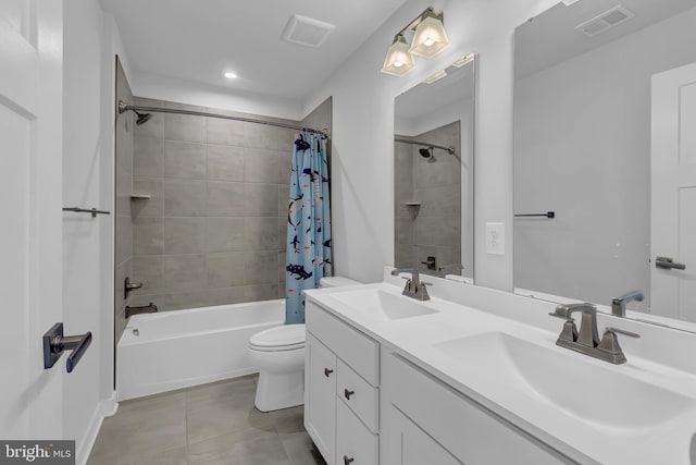 full bathroom featuring tile patterned floors, shower / tub combo with curtain, vanity, and toilet