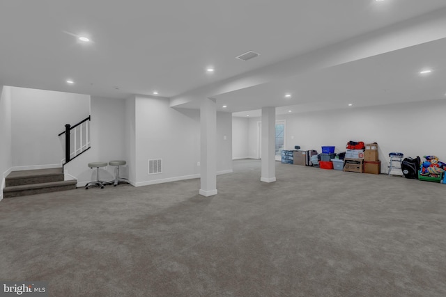 basement featuring light carpet