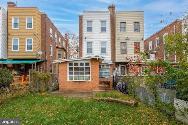5122 N Broad St, Philadelphia, PA 19141 - back of house featuring a lawn