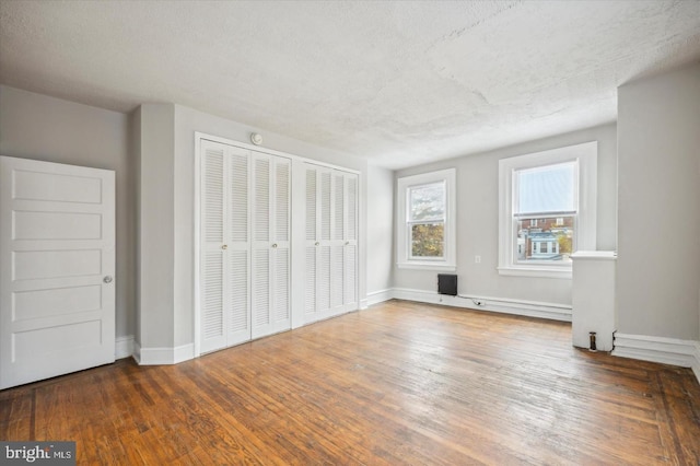 5122 N Broad St, Philadelphia, PA 19141 - unfurnished bedroom featuring dark hardwood / wood-style flooring and a textured ceiling