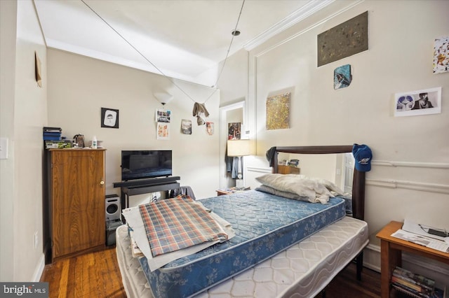 5122 N Broad St, Philadelphia, PA 19141 - bedroom featuring dark hardwood / wood-style floors and ornamental molding