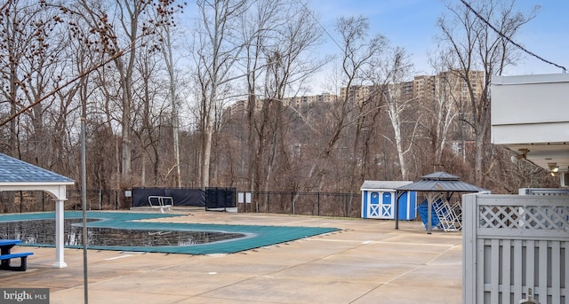 view of swimming pool with a gazebo and a patio