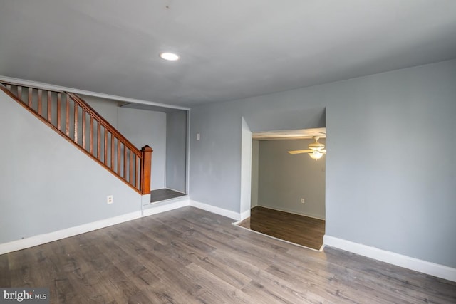 unfurnished living room with ceiling fan and hardwood / wood-style floors