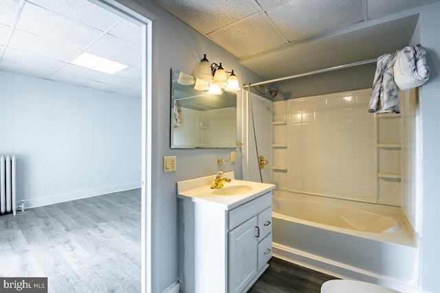 full bathroom with vanity, radiator heating unit, shower / bathing tub combination, and wood-type flooring