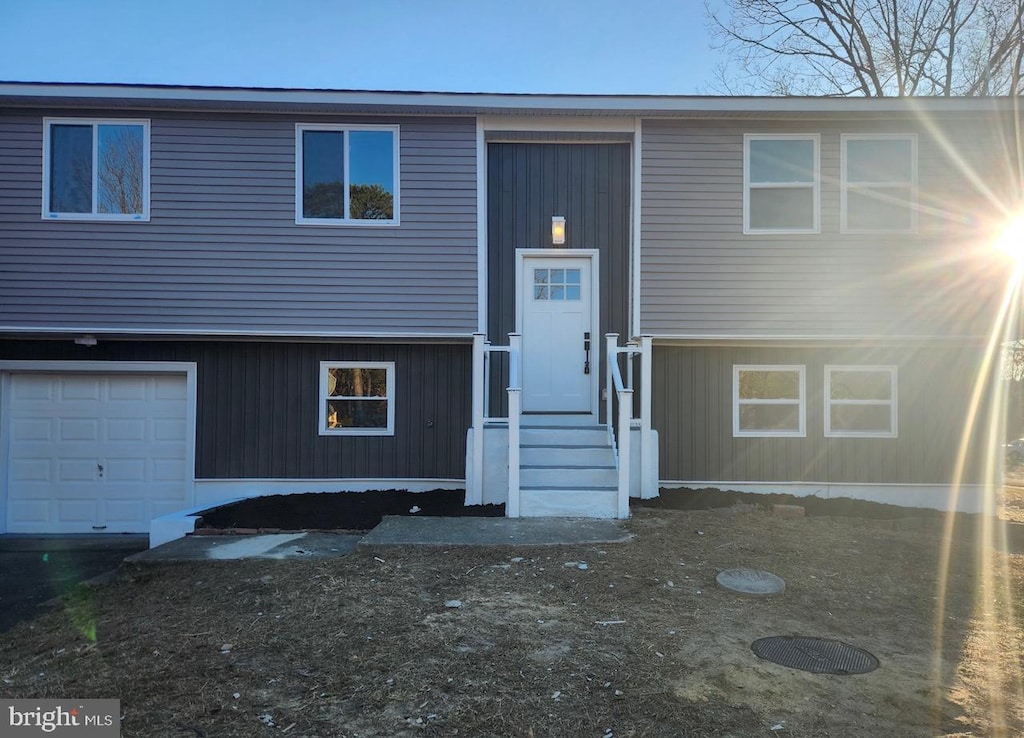 split foyer home featuring a garage