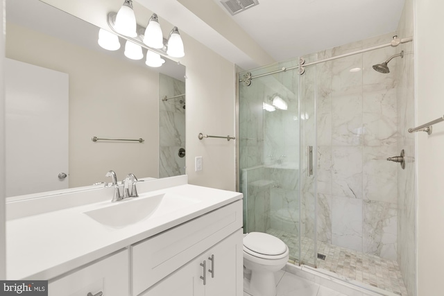 bathroom with a shower with shower door, vanity, and toilet