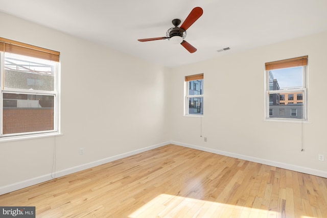 unfurnished room with ceiling fan and light hardwood / wood-style floors