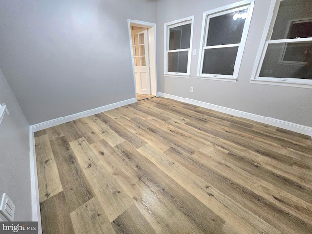 spare room with hardwood / wood-style flooring