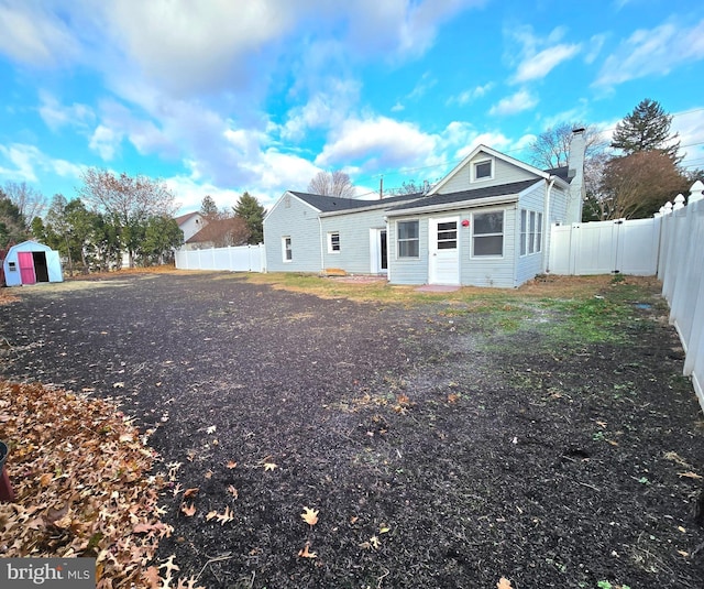 view of front of house featuring a shed