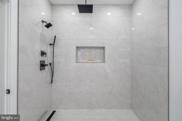 bathroom with a tile shower