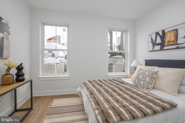 bedroom with light wood-type flooring