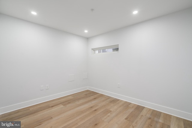 spare room with light hardwood / wood-style floors