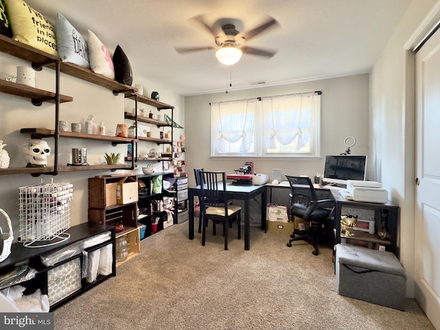 office space with light carpet and ceiling fan