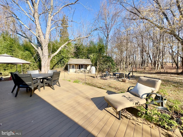 deck featuring an outdoor structure