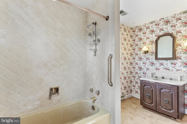 bathroom with tile patterned floors, vanity, and tiled shower / bath combo