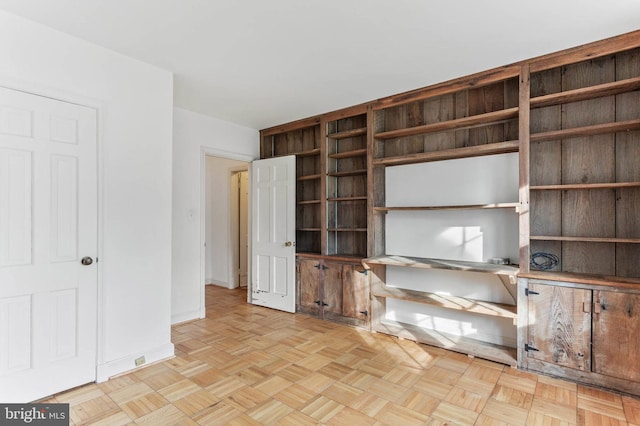 unfurnished living room featuring light parquet floors