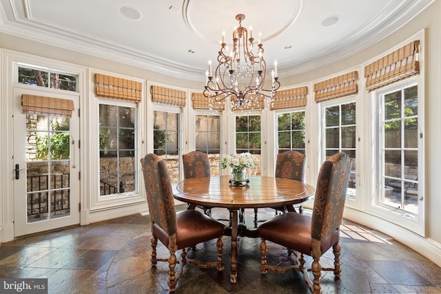 dining room featuring crown molding and an inviting chandelier