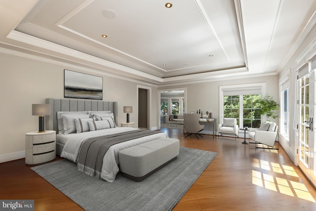 bedroom featuring dark hardwood / wood-style floors, ornamental molding, a raised ceiling, and french doors