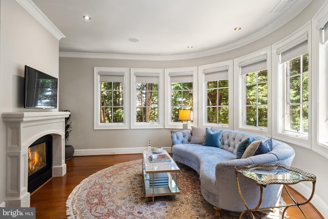 living room featuring crown molding and dark hardwood / wood-style floors