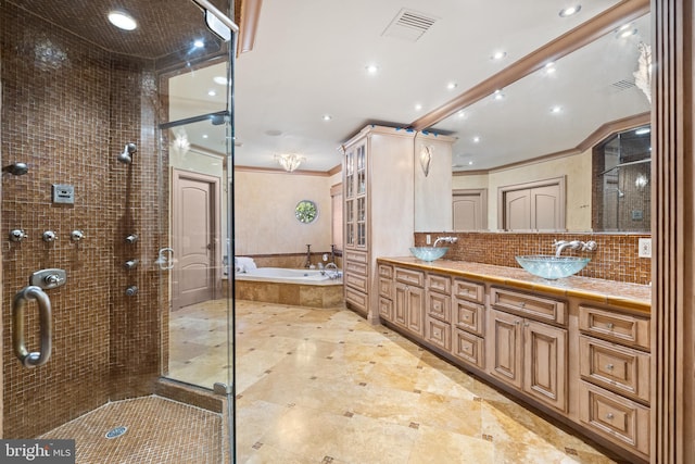 bathroom with ornamental molding, separate shower and tub, vanity, and backsplash