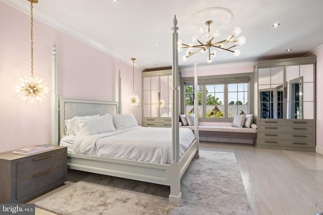 bedroom featuring an inviting chandelier, crown molding, and wood-type flooring