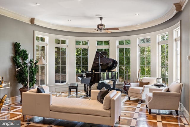 sunroom / solarium featuring ceiling fan