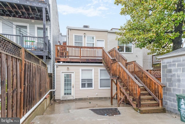 back of house featuring a patio area, stairway, fence, and a deck