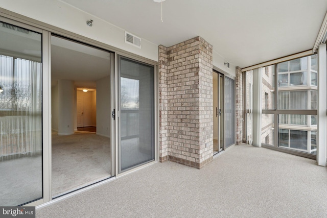 unfurnished sunroom with a wealth of natural light