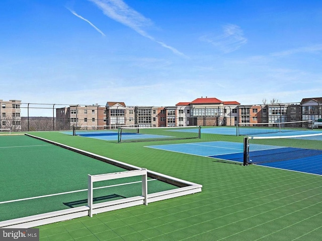 view of sport court with community basketball court and fence