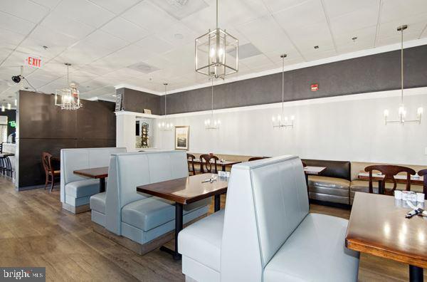 dining area featuring a notable chandelier and wood finished floors